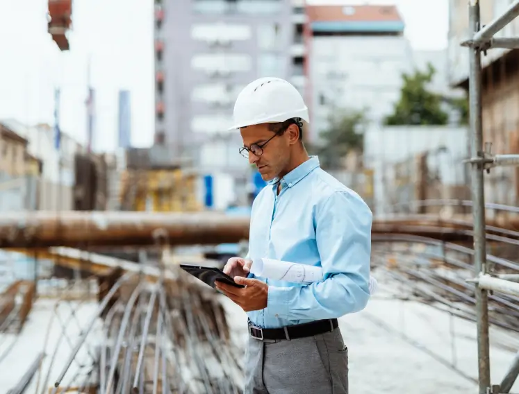 Man standing in front of fountain with inspection clipboard
